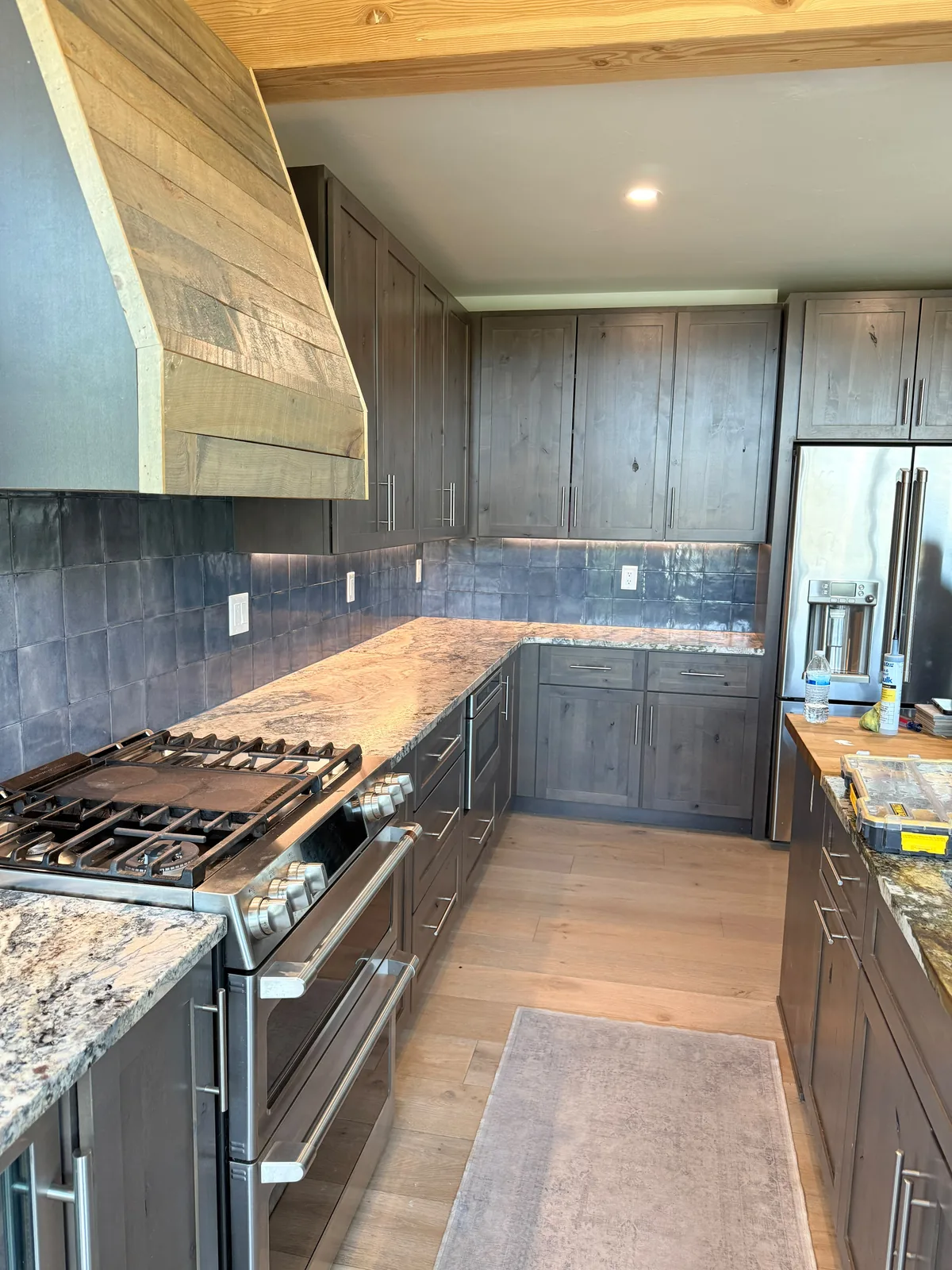 Full kitchen remodel with custom wood hood, granite counters and new cabinets